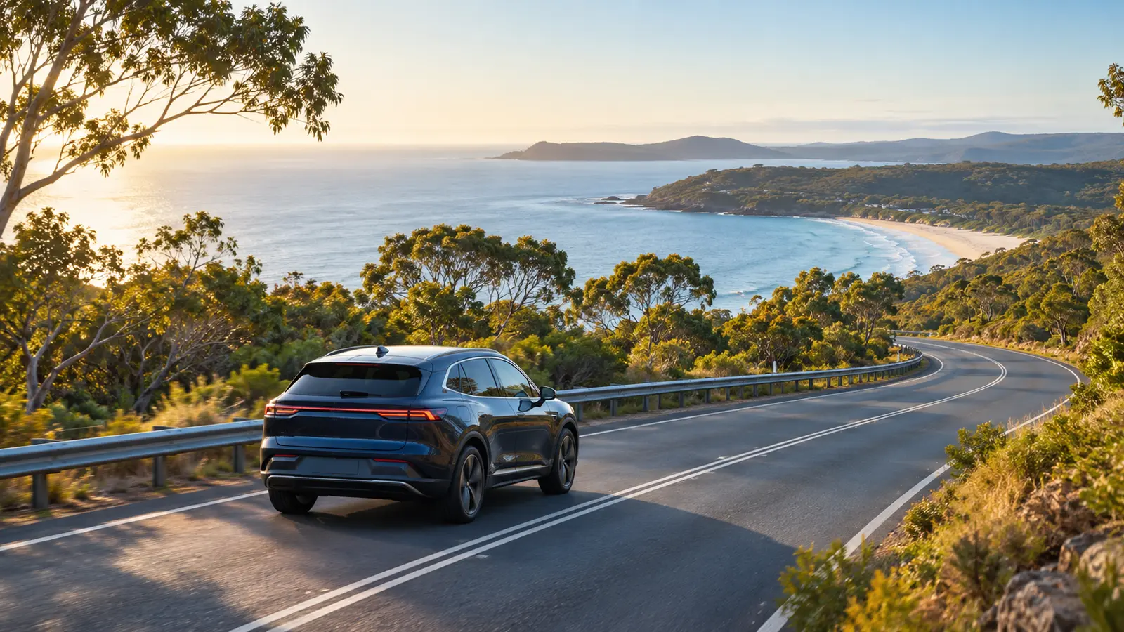 Electric vehicle travelling along an Australian coastal road